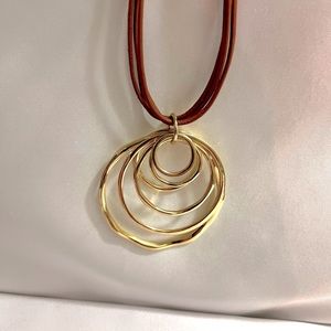 NWOT Lucky Brand gold necklace/6 gold circles within ea other. Never worn